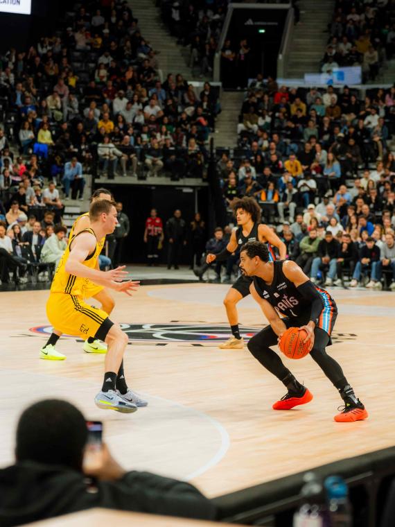 Courtside seats at the Adidas Arena for the Paris Basketball vs Alba Berlin EuroLeague game, offering an up-close view of the action