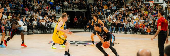 Courtside seats at the Adidas Arena for the EuroLeague match between Paris Basketball and Alba Berlin, offering an up-close view of the action