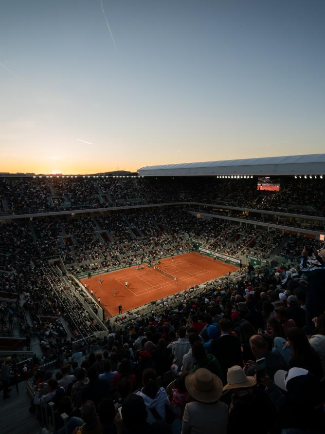 A nightime view of the Court Philippe-Chatrier at Roland Garros from the stands during a match