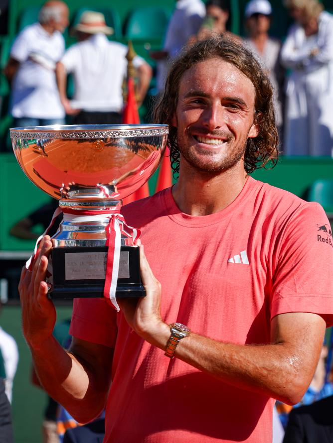 Stefanos Tsitsipas holding the winner trophy in Monte Carlo 