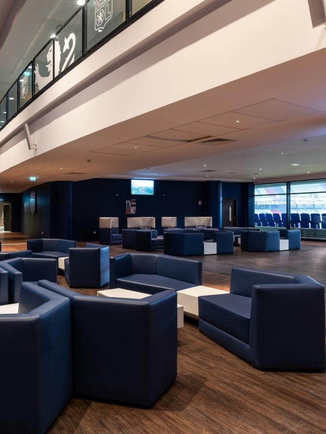 Exclusive hospitality lounge with a cocktail service at Groupama Stadium, located in the Salon des Lumières Cercle, offering a premium experience for guests.